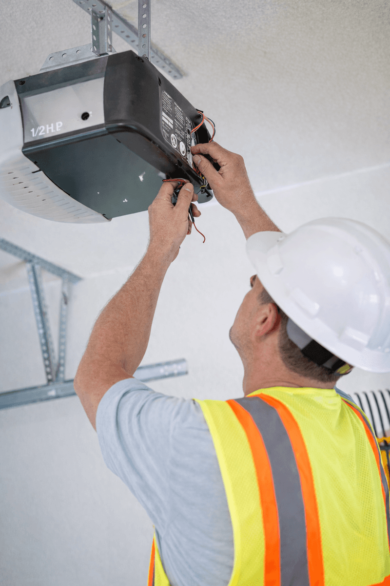 Sean performing garage door maintenance service